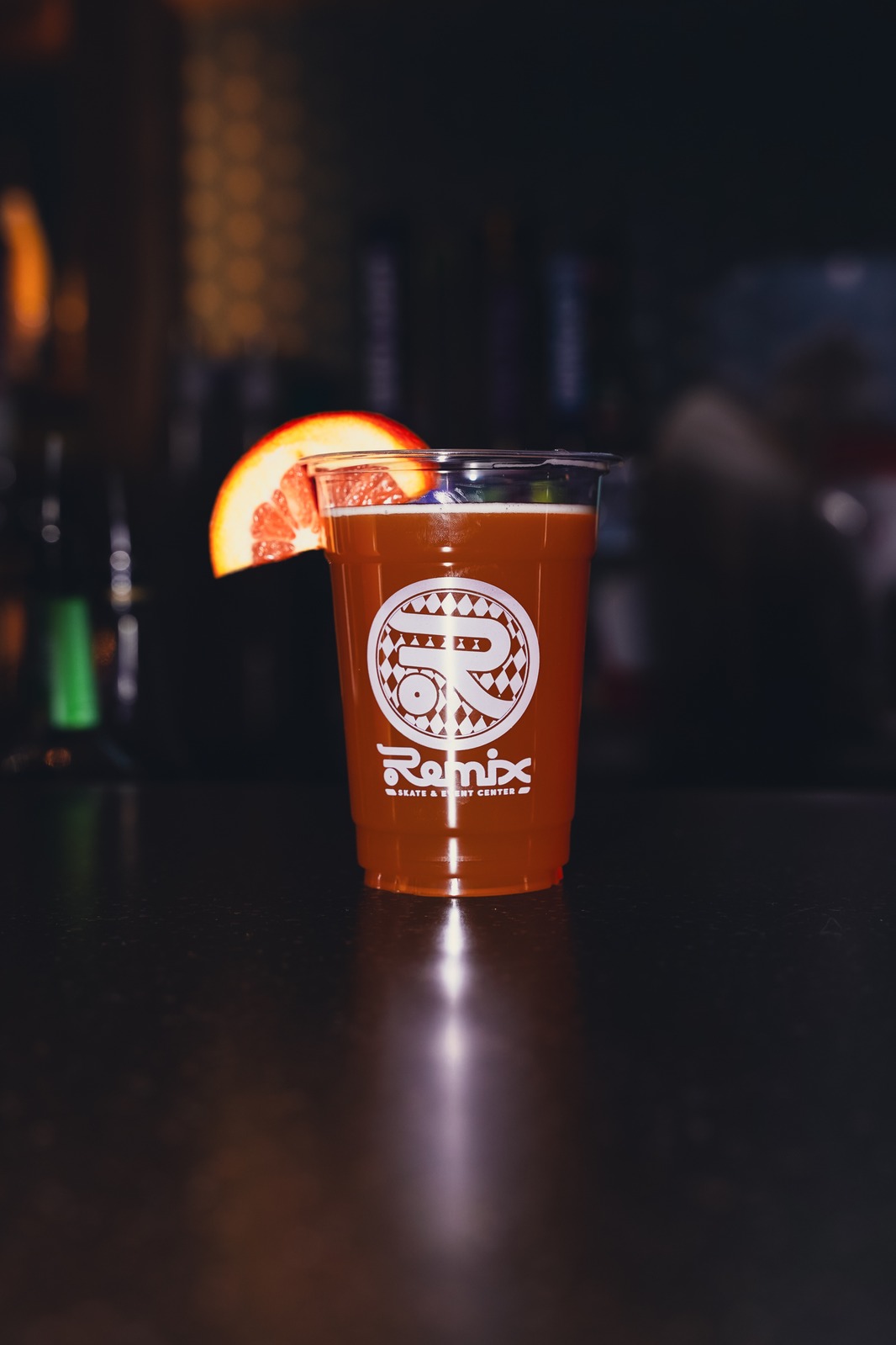 A cocktail served in a Remix branded cup